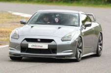 Kids drive a Nissan GTR